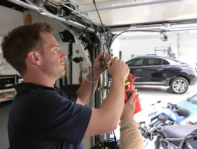Laguna Niguel Garage Door Repair safety certified technician performing cable replacement in Laguna Niguel