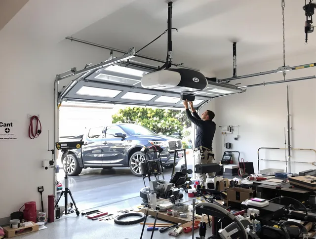 Laguna Niguel Garage Door Repair specialist installing smart garage door opener system in Laguna Niguel home
